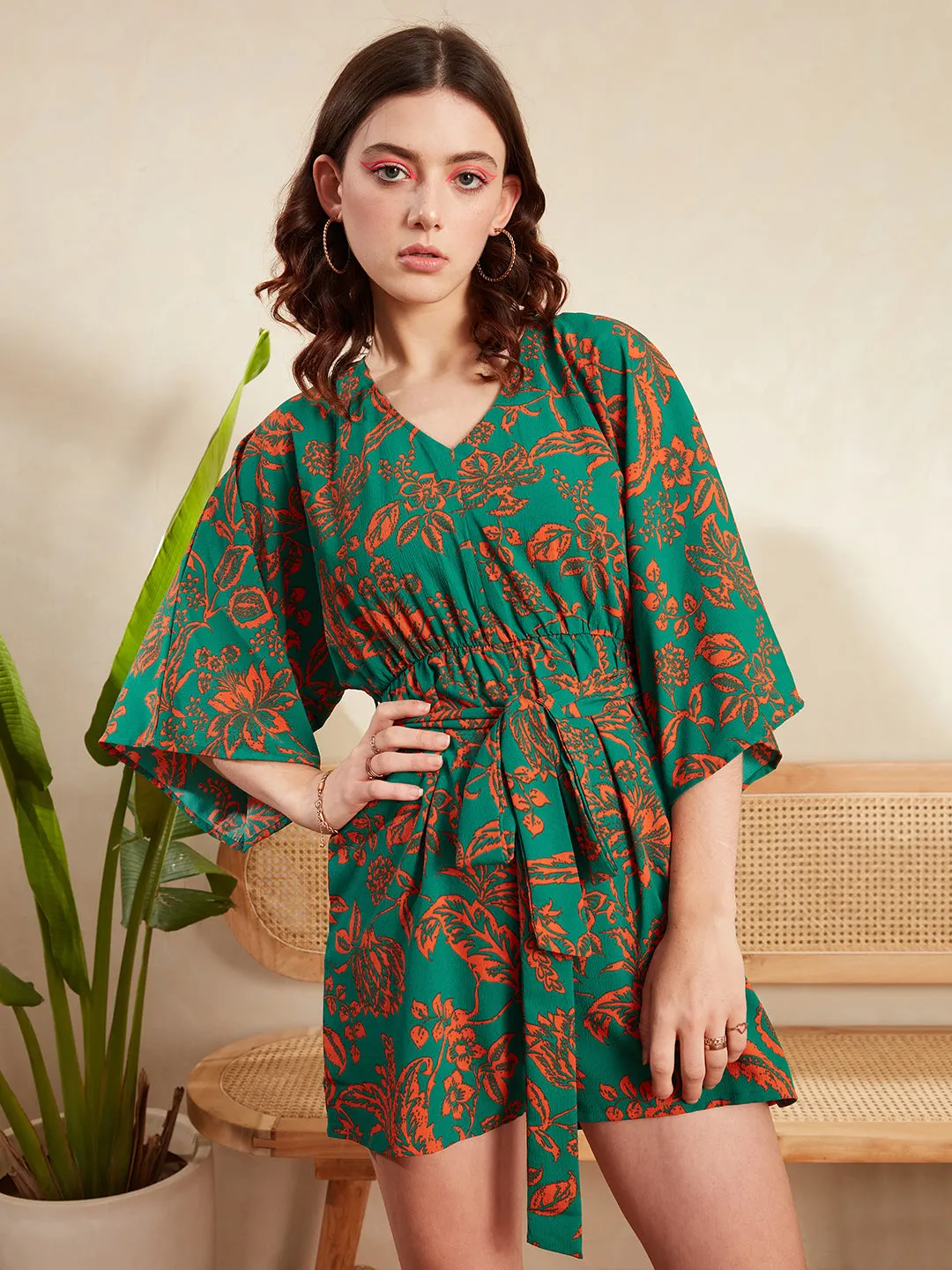 Berrylush Women Green & Orange Floral Printed V-Neck Batwing Sleeve Tie-Up Waist Pleated Mini Jumpsuit