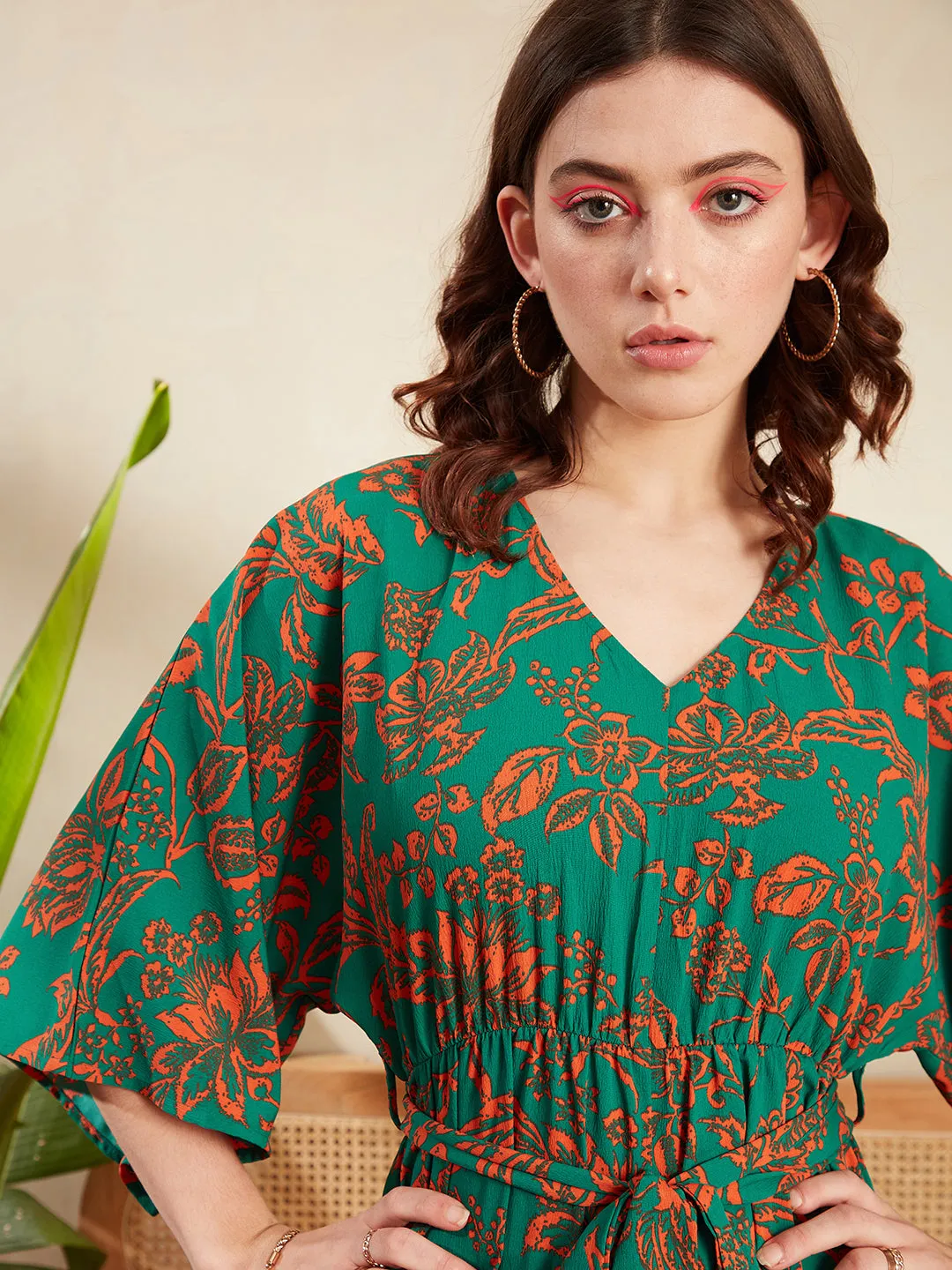 Berrylush Women Green & Orange Floral Printed V-Neck Batwing Sleeve Tie-Up Waist Pleated Mini Jumpsuit