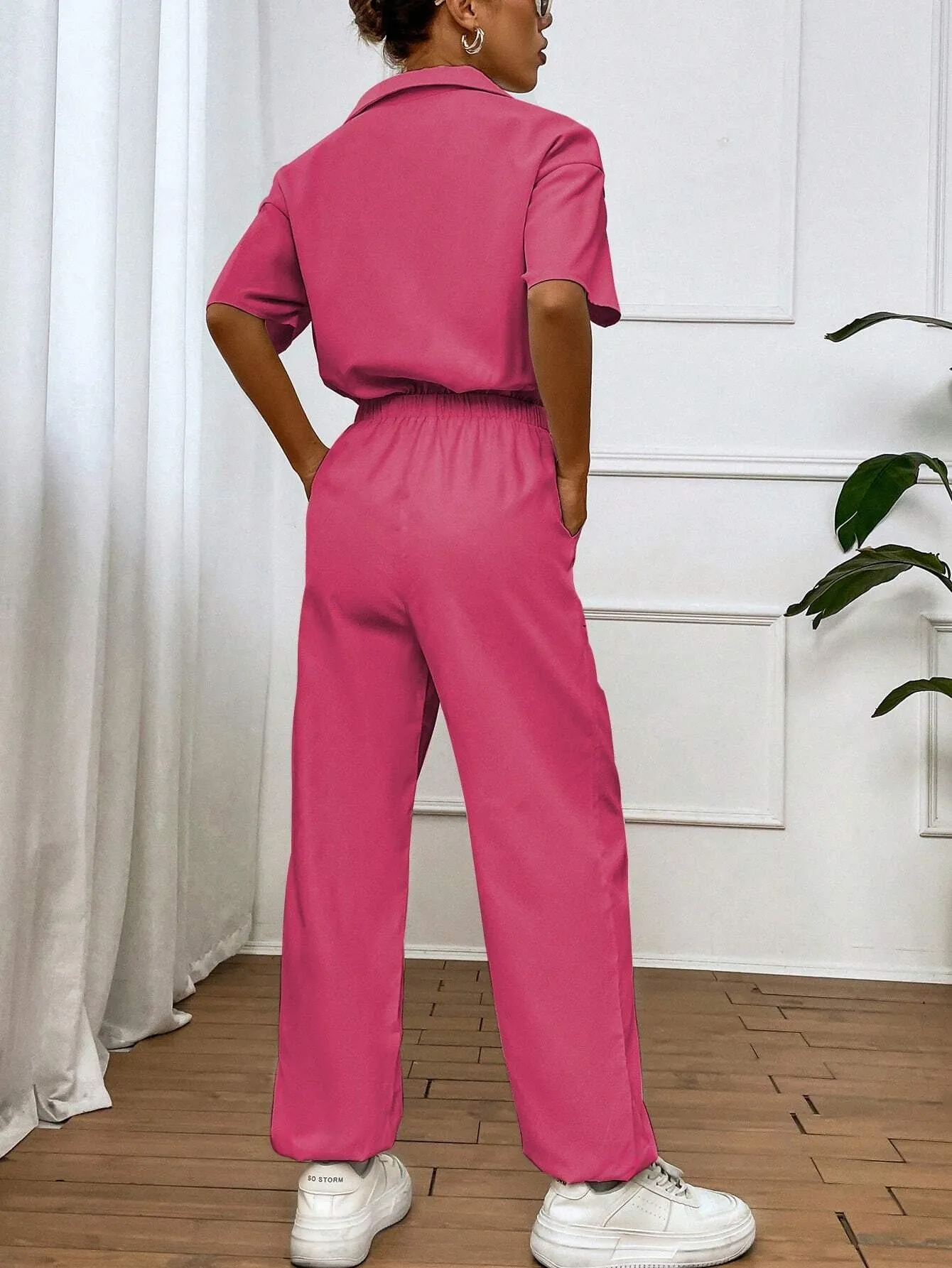 Solid Color Jumpsuit With Pockets And Front Button Placket SS24