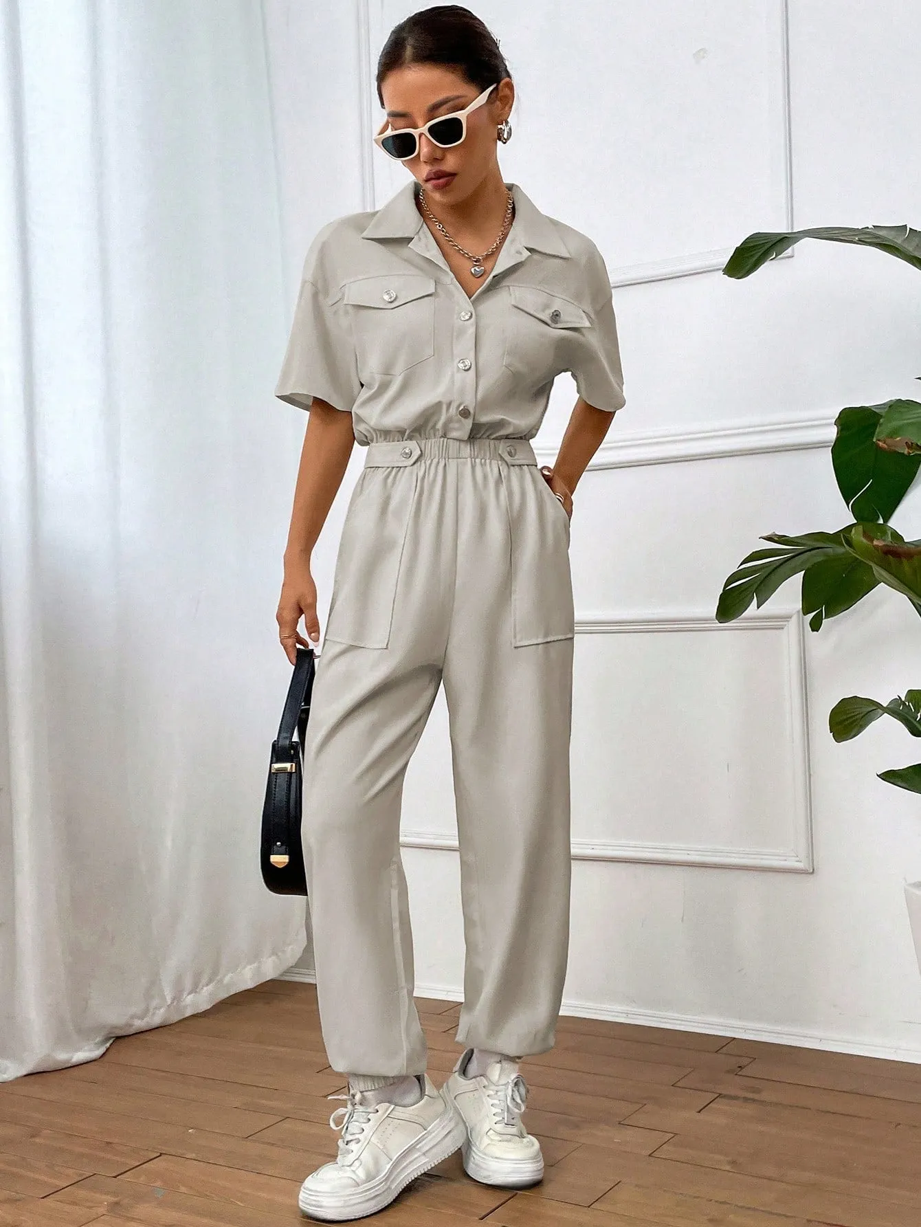 Solid Color Jumpsuit With Pockets And Front Button Placket SS24